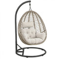Ovale hangstoel met standaard van PE-rattan en staal, beige/zwart/crème, 95 x 95 x 195 cm